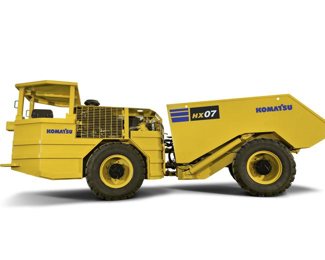 Komatsu HX07 underground mining trucks in white background