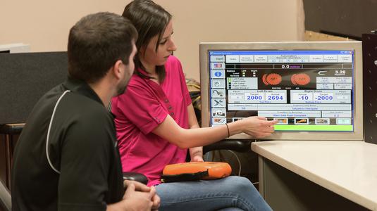 Komatsu employees reviewing equipment data