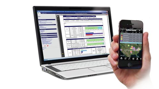 Phone and laptop displaying KOMTRAX data for dozers