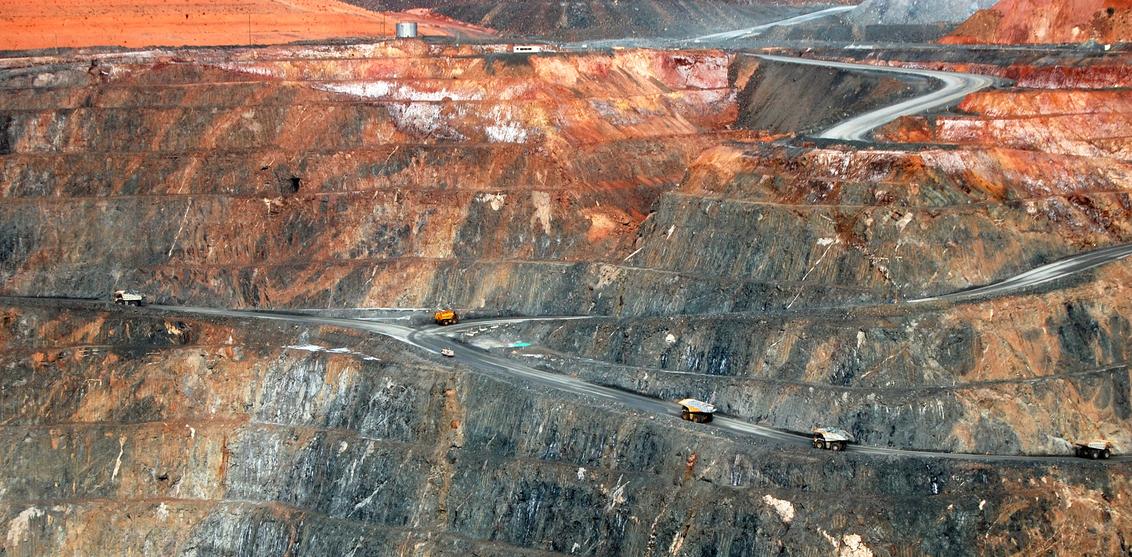 bigstock-Trucks-In-Super-Pit-Gold-Mine--37390492.jpg